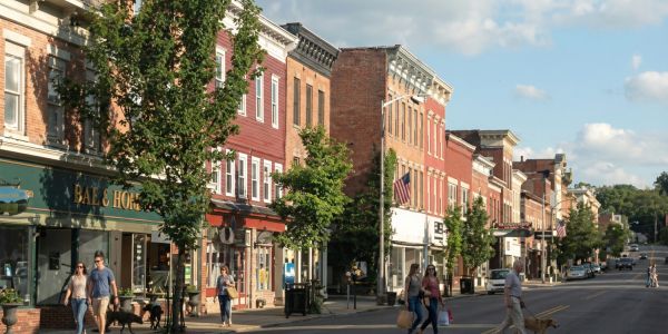 Fall foliage in Stowe, Vermont with colorful autumn trees surrounding mountain homes and rolling hills