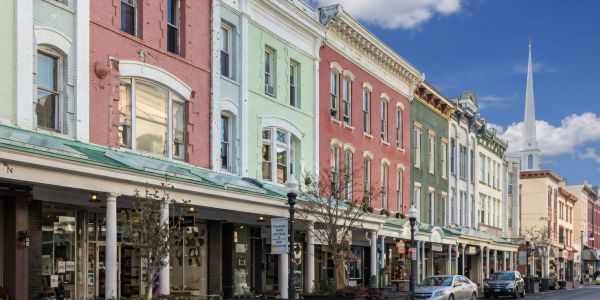 Fall foliage in Stowe, Vermont with colorful autumn trees surrounding mountain homes and rolling hills