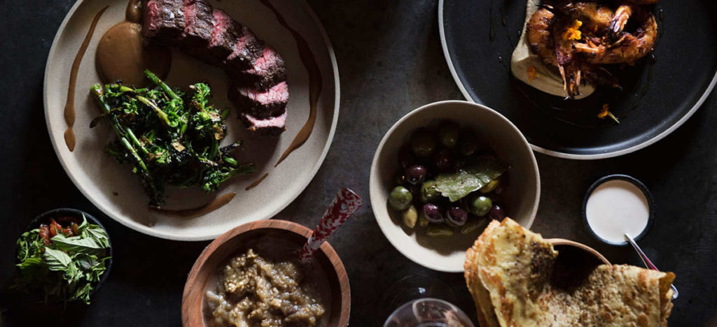 Top down view of table with assorted delicious food 