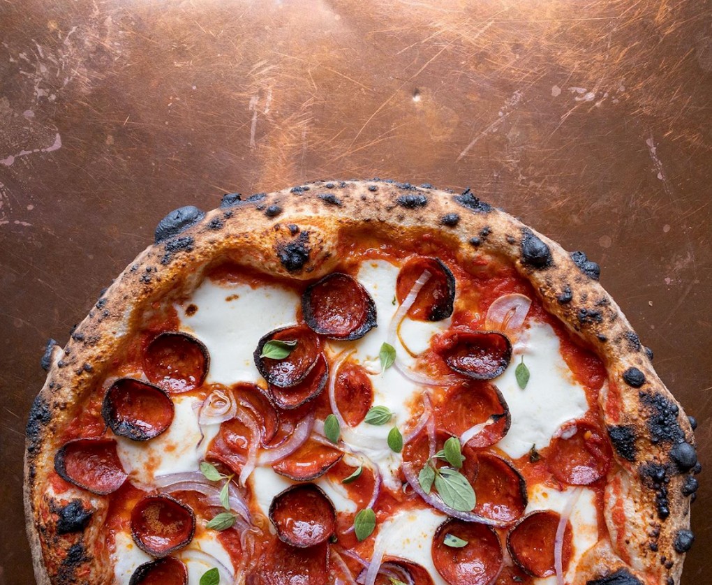 Pepperoni and onion woodfired pizza pie