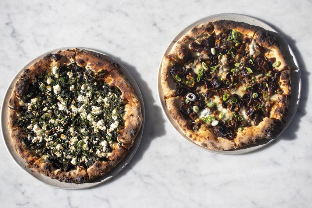 Two specialty pizzas