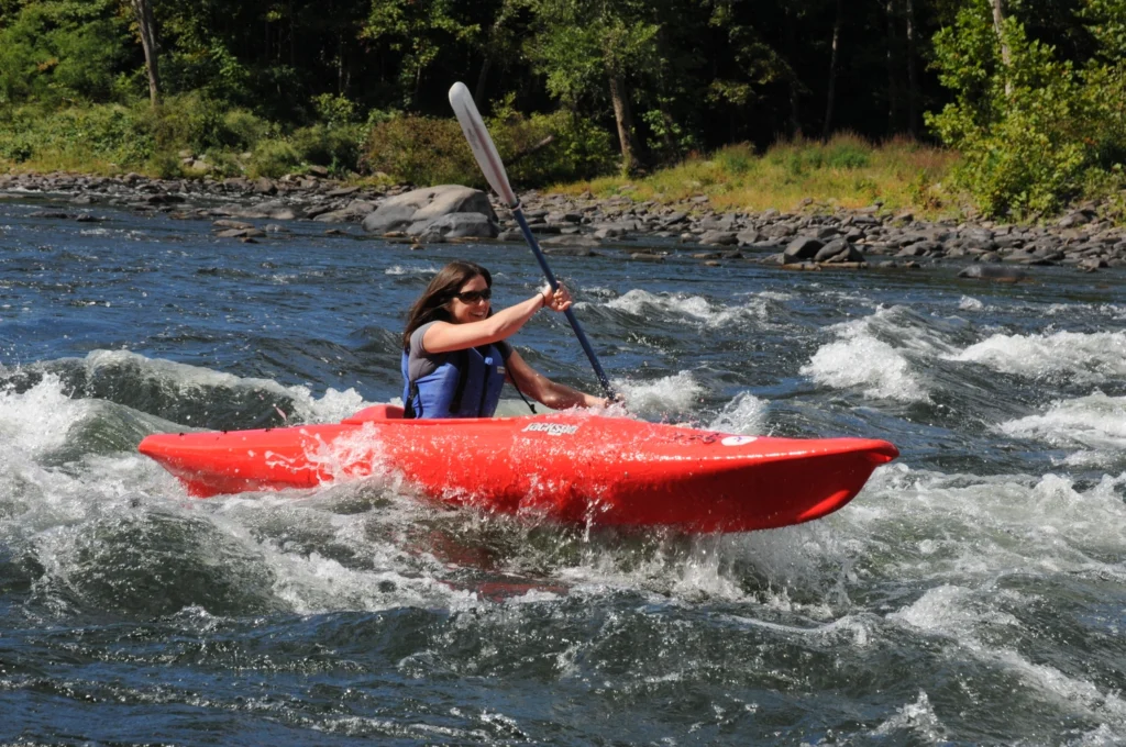 Girl kayaking in river