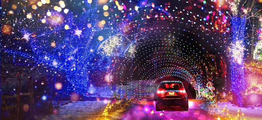 Drive-through Christmas light show in the Hudson Valley, New York with glowing tunnels and holiday displays